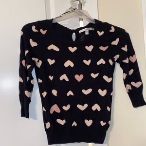 Cute black and heart sweater with bow tie accent